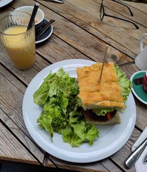 Quinoa burger and banana-orange smoothie at Simbio in Bucharest