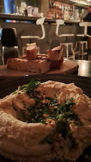 Hummus di cannellini e focaccia at Simbio in Bucharest