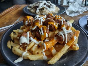 Fries, popcorn chicken, Carolina gold, cheese, and ranch at Imagine Vegan Cafe in Memphis