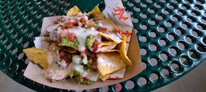 Nachos: bland and watery "cheesy" sauce topping - blegh! at Vegan City - Citi Field in New York City