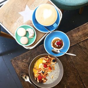 Breakfast chia bowl, cupcake, macarons, latte. at Cloud Cakes -  Notre Dame de Lorette in Paris