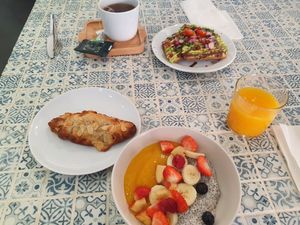 Breakfast chia bowl, almond croissant, avocado toast. at Cloud Cakes -  Notre Dame de Lorette in Paris