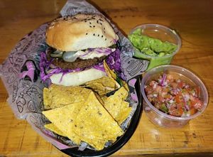K-pop burger with nachos, pico de gallo, guacamole at Lado V in Buenos Aires