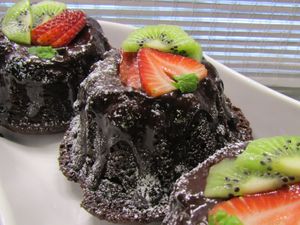 Mini Chocolate Bundt Cakes. Ganache lava flows from these mini chocolate bundt cakes that are moist and tender with pieces of fresh fruits and a rich chocolate ganache filling.  at Vegan Delights LG Inc in Sioux Lookout