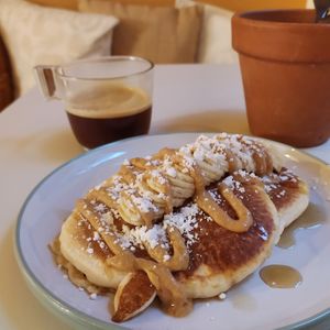 Robin's pancakes (banana, homemade pb, maple syrup) and double espresso.  at De Bon'heur in Marseille