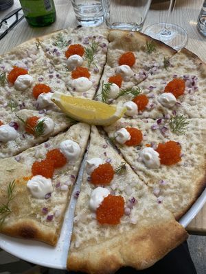 Pizza with caviar and sour cream  at ChouChou in Stockholm