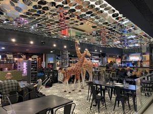 Inside the food court in the bar area with seating  at Kitchen Market in Lille