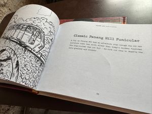 Local comic books about the location   at SUSU Vegan Mylk Bar Penang in Penang