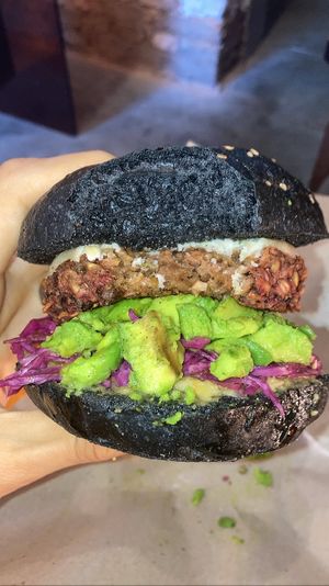 Burger with beetroot/mushroom/oat patty, vegan cream cheese, avocado and pickled veggies. Delicious   at SUSU Vegan Mylk Bar Penang in Penang