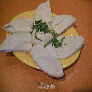 Hummus and pita plate is made with local organic garbanzo beans & our now homemade pita bread. at Holy Cow on Willamette in Eugene