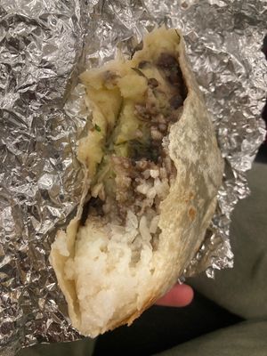 Got veggie burrito white rice, black beans, papas con rajas, no queso fresco. at LAX - Lotería Grill - T5 in Los Angeles