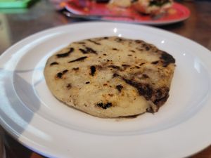 Bean and cheeze pupusa before the toppings at Mama's International Tamales in Los Angeles