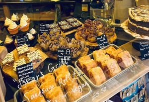 Front counter with vegan sausage rolls at The Coffee Hut in Helston