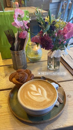 Oat latte and cinnamon bun  at The Coffee Hut in Helston
