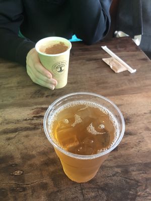 Latte and iced green cinnamon tea - didn’t know they use disposable cups😒 at Copper Branch in Lisbon