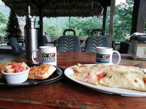 Breakfast: white beans on toast and crepa with fruit at Zephyr in Lanquin