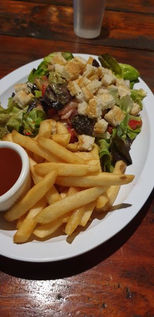 Salad with fries at Zephyr in Lanquin