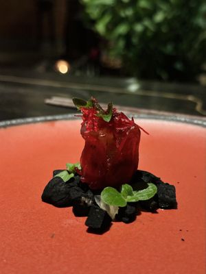 Candied hibiscus on charcoal chestnut. Part of set menu “Vietnam” (950k VND)  at Cổ Đàm Chay in Hanoi