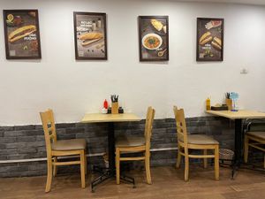 2 sets of tables for eating in at Bánh mí Vegan Vietnam in Hanoi