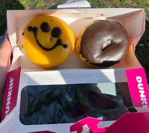 smiley cream and boston cream donuts  at Dunkin' - Stationsplein in Amsterdam
