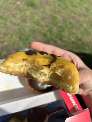 smiley cream donut  at Dunkin' - Stationsplein in Amsterdam