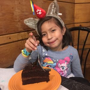 birthday girl with Glorious Chocolate Cake at The Cheeze Factory Restaurant in Baraboo