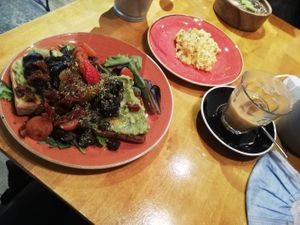 Vegan toast and oat milk iced coffee at Zenith Brunch & Cocktails in Madrid