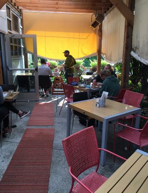 Outside seating with retractable ceiling/walls, and overhead heaters for colder weather. at Wise Acre in Minneapolis