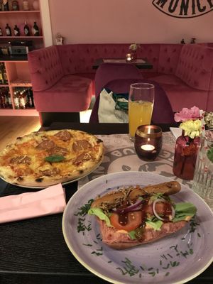 We had pizza and hotdog! It was very delicious and we enjoyed the atmosphere in the restaurant.  at Vegan Junkhouse Club in Munich