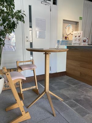 You can sit in chairs or on a bench. I have a big butt so I chose the bench.  at Dolala in Yokohama