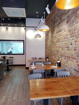Sitting area, you can see in the kitchen at Olives and Meze in South West London