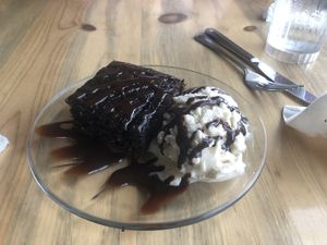 Chocolate cake with a scoop of vegan ice cream  at Sweet Melissa Cafe in Laramie