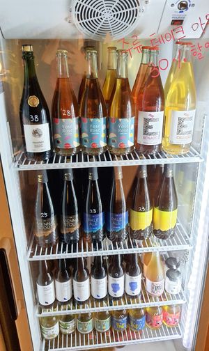 Display of bottled alcohol at Jigushop - Sangdo 지구샵 상도점 in Seoul