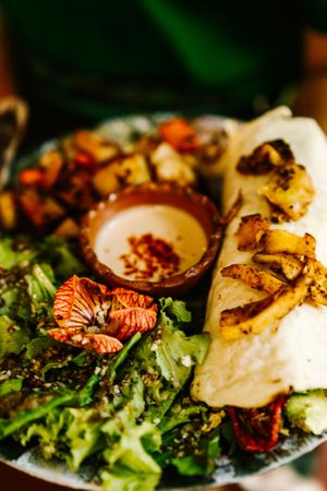 Brunch plate with sourdough crepe at The Emporium in San Marcos La Laguna