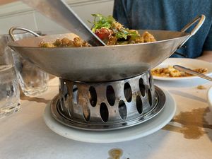 Fire underneath clay pot at Da Sichuan Bistro in Palo Alto
