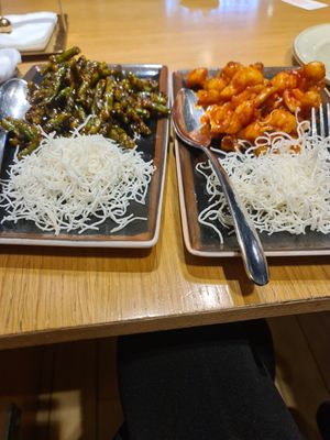 Green beans in sweet soy sauce and sesame. And buffalo cauliflower. Both with fried rice noodles and Both the small (70%) meal size. at Gan Bei in Riga