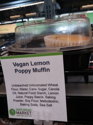 Vegan lemon poppy muffin in bakery case on end cap at Earth Origins Market in Port Charlotte