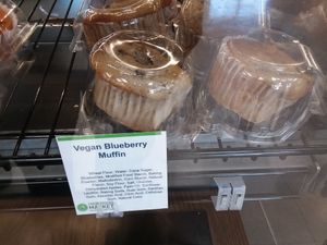Vegan blueberry muffins in bakery case on end cap at Earth Origins Market in Port Charlotte