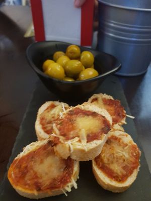 Tapas (olives and some cheesy bread) at Pasiones Bar  in Gijon