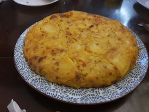 Whole Spanish tortilla with chorizo at Pasiones Bar  in Gijon