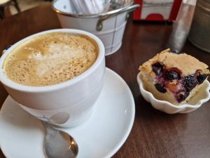 Café con soja y bizcocho vegano con arándanos at Pasiones Bar  in Gijon