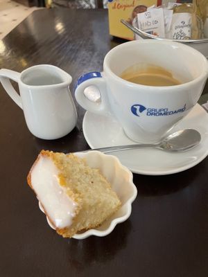 Café americano with iced lemon sponge   at Pasiones Bar  in Gijon