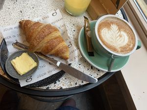 Croissant with vegan butter and red fruit jelly (not shown here): tasty and flaky. The chai latte with oatmilk was very good as well. at Anne&Max in Apeldoorn