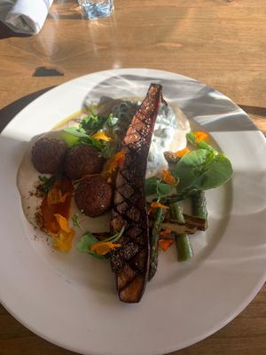 Falafel and eggplant with hummus and tzatziki sauce and asparagus -$29   at Meander Riverside Eatery in Pagosa Springs