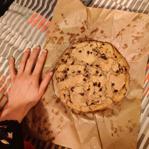 Fat cookie (hand for scale) at Jimmy's Street Food in Paris