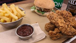 Burger, tenders, fries and BBQ sauce at Jimmy's Street Food in Paris