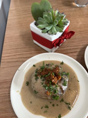 A biscuit and gravy a la cart with a lil quinoa sausage on top   at Graze Kitchen  in Las Vegas