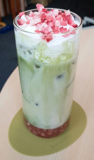 Matcha oatmilk latte with strawberries at Godny Cafe in Seoul