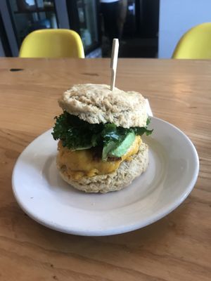 Bacon, egg, cheese, avo, kale, on a biscuit.  at Dulce Vegan Bakery and Cafe in Atlanta