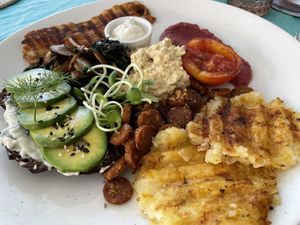 Breakfast all day with home made tofu. mock bacon, avo, sour cream, beetroot purée, sausage  at Soul Phuket in Phuket